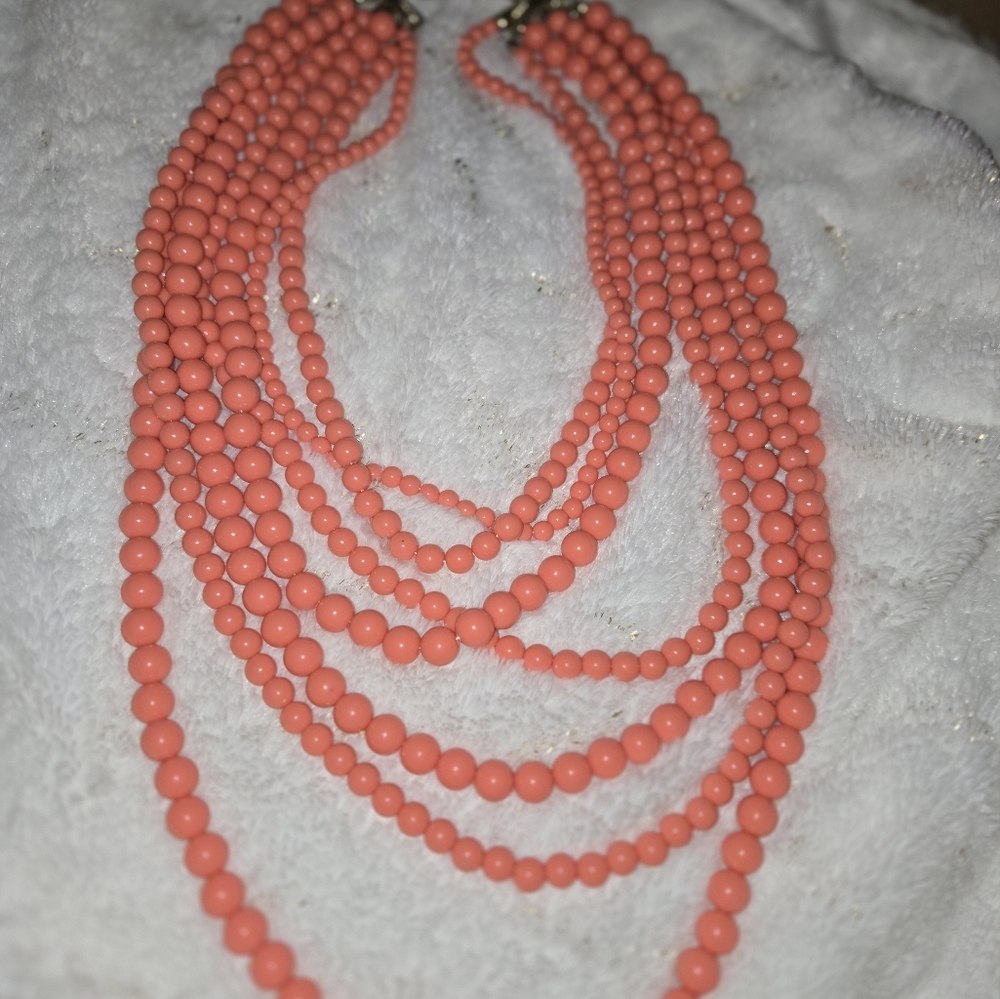 **3/$10**  Seven strand coral colored acrylic beads - Picture 2 of 2